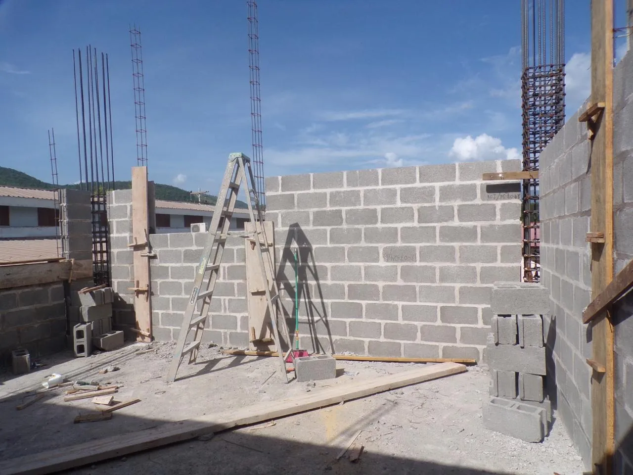 Workers building classrooms for the high school and college at the City of Refuge